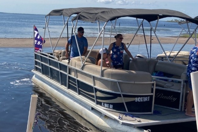 a group of people on a boat in the water